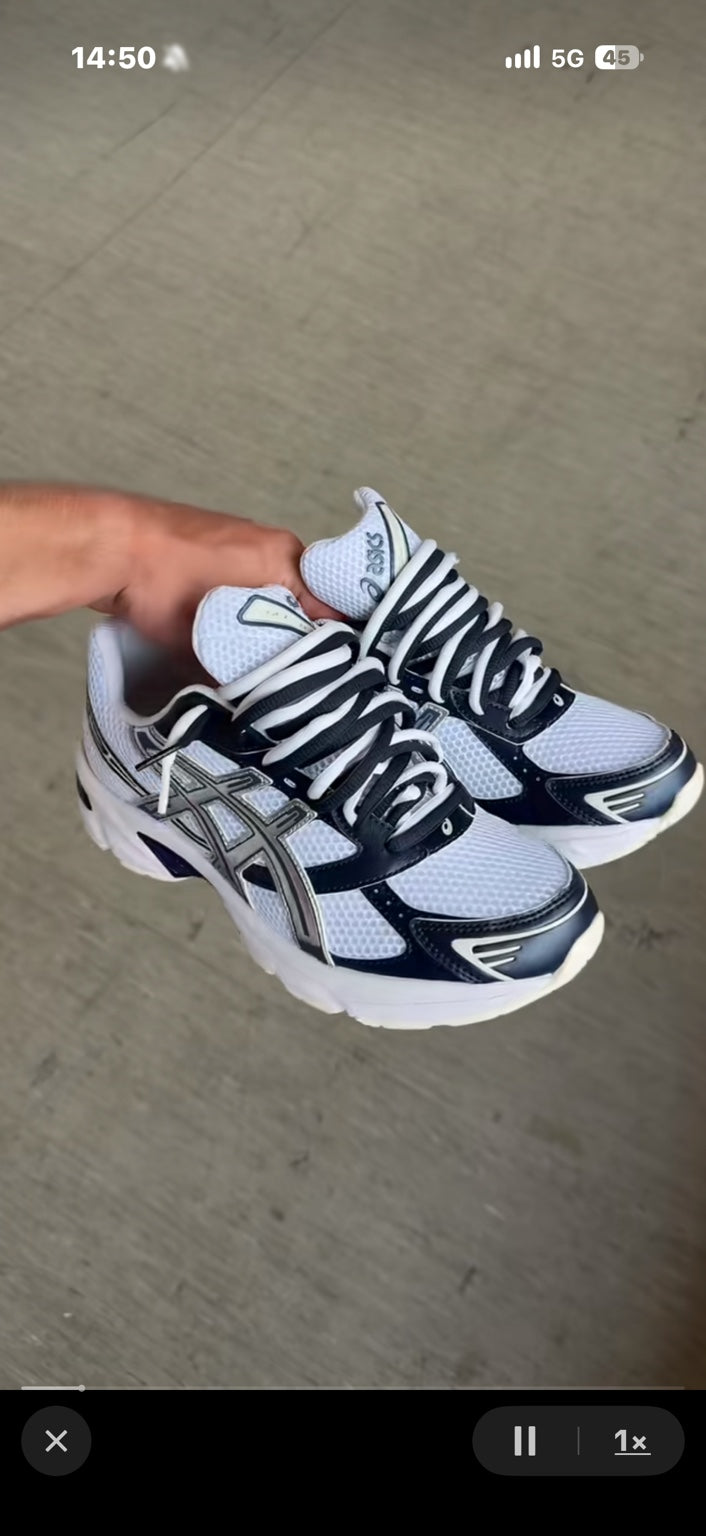 Double-lace styling with original white laces and two additional black laces