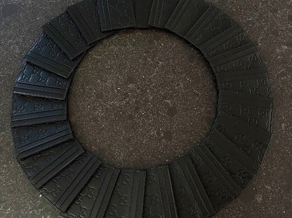 Black GG embossed cardholders arranged in a circle